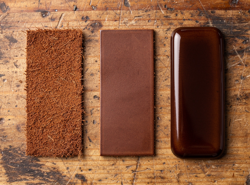 Comparison of three leather edges side by side showing raw cut edge, bevel and sand only, and fully burnished glass-smooth finished edge with rich brown color