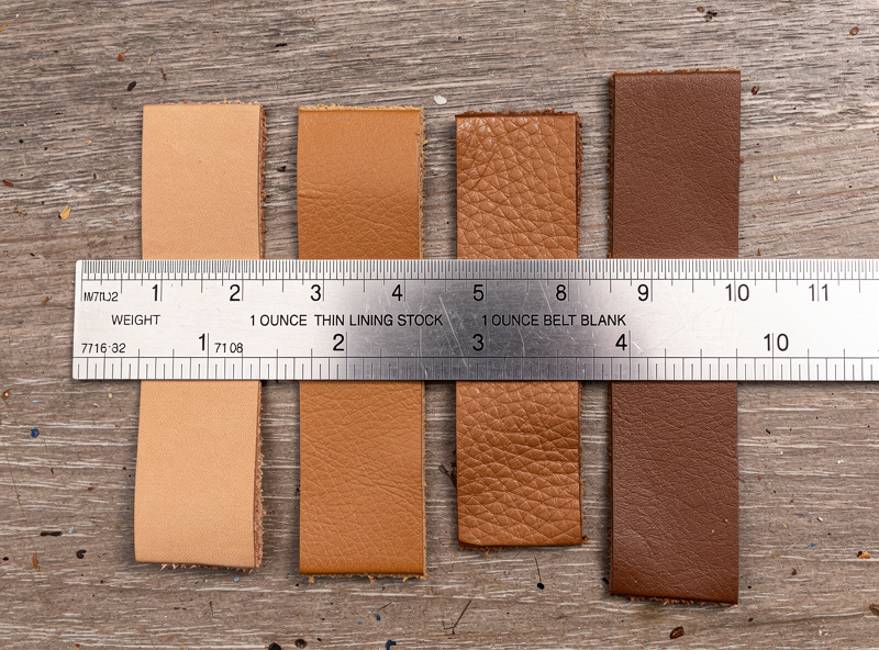 Six leather weight samples lined up from 1 ounce thin lining stock through 10 ounce belt blank on a wooden ruler showing thickness gradient