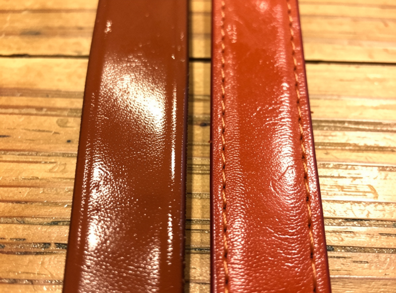 Bridle leather strap and latigo leather strap side by side on a workshop bench showing color and surface differences