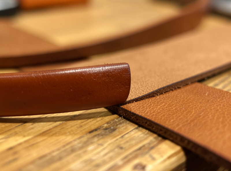 Burnished edge comparison between a bridle leather collar and a latigo leather strap