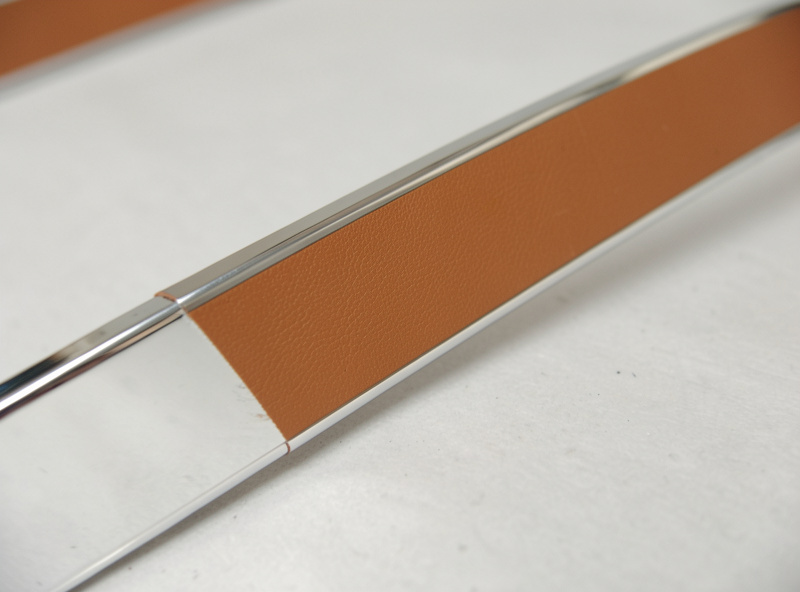A finished chrome-tan bag strap edge coated smoothly with edge paint instead of burnished