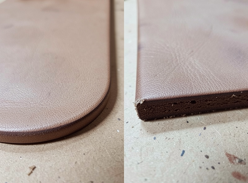 Comparison of a beveled rounded leather edge next to a raw square-cut edge