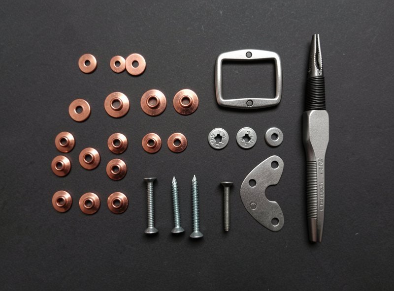 Leather hardware: copper rivets, snaps, Chicago screws, a buckle, and a setter tool