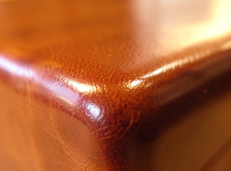 Burnished and waxed edge of a finished leather journal cover