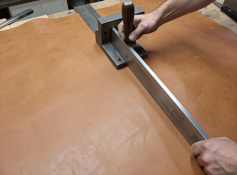 Cutting a long straight edge on thick veg-tan leather with a clamped steel straightedge
